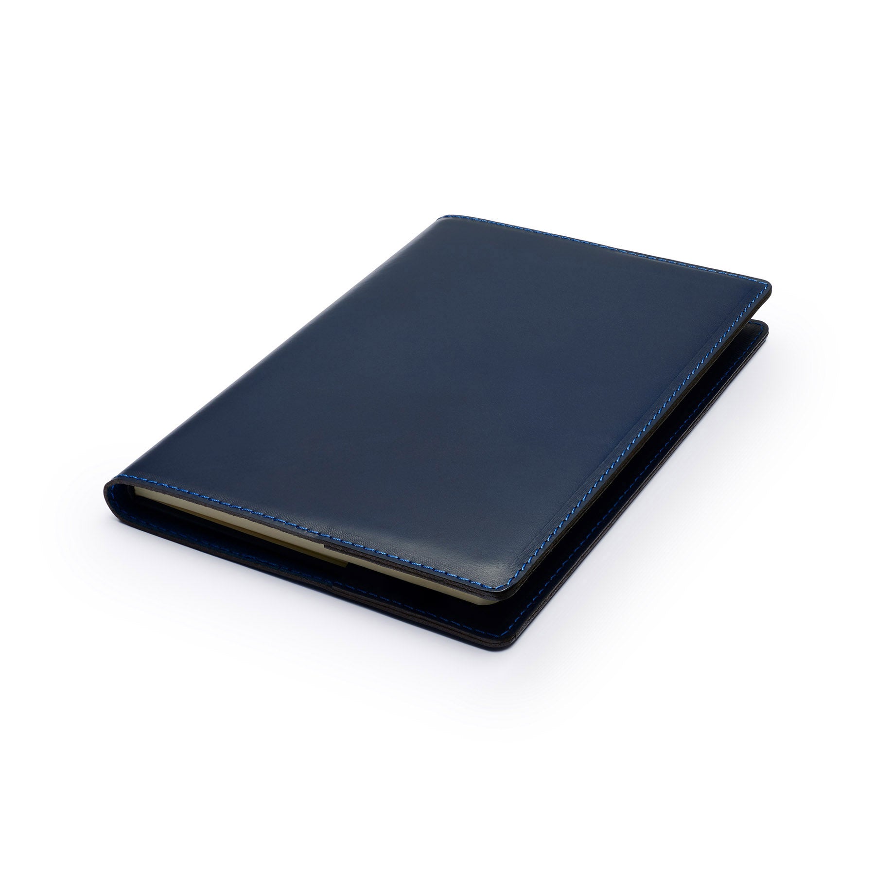 Navy full-grain leather A5 notebook, flat lay, angled view — personalised — CarveOn, made in Ireland#Color_Navy
