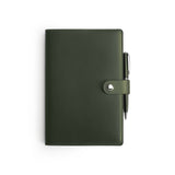 Green Moleskine notebook with leather cover and pen, flat lay — personalised gift — CarveOn, made in Ireland