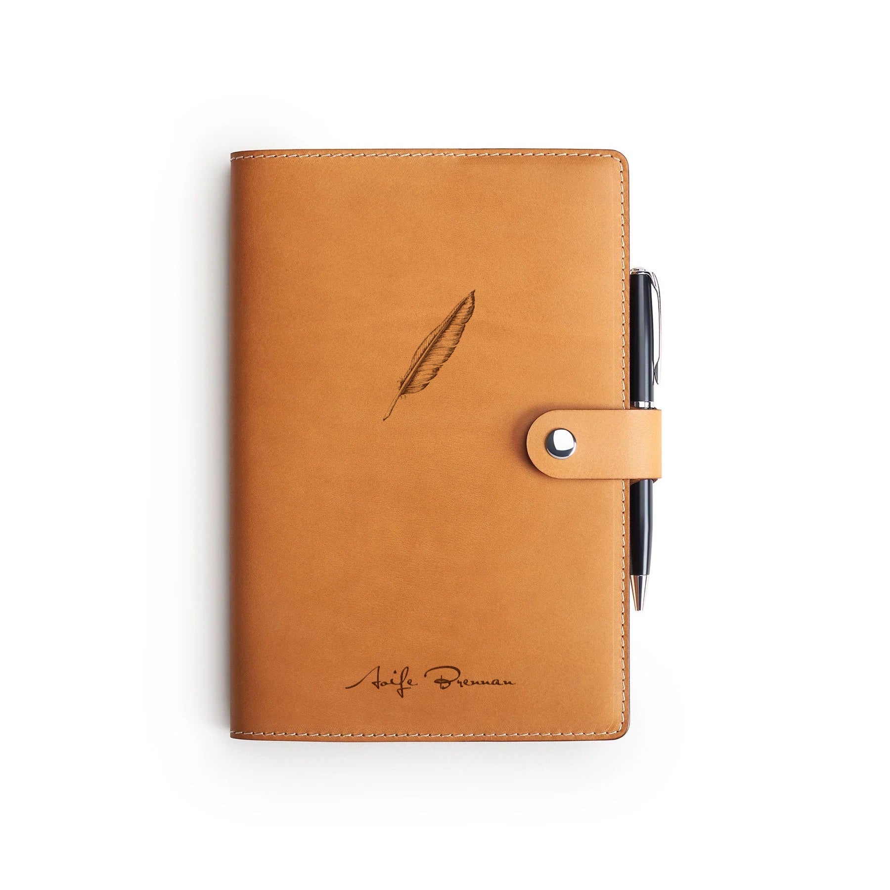 Tan full-grain leather A5 notebook and pen set, flat lay, engraved with a quill and a name — personalised — CarveOn, made in Ireland#Color_Tan