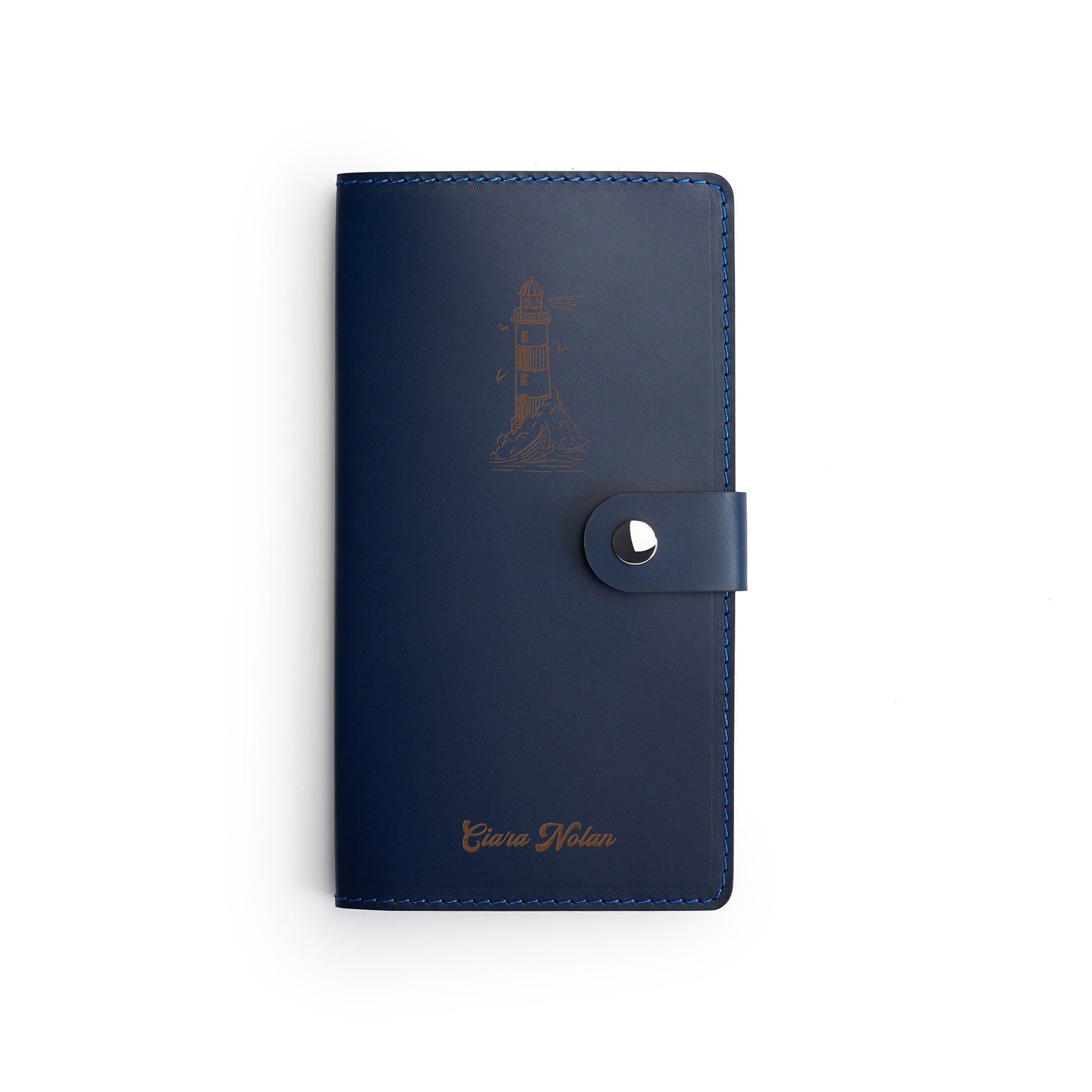 Navy full-grain leather travel wallet, flat lay, engraved with a lighthouse and a name — personalised — CarveOn, made in Ireland#Color_Navy