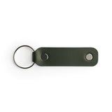 Green full-grain leather keyring, flat lay — personalised gift — CarveOn, made in Ireland