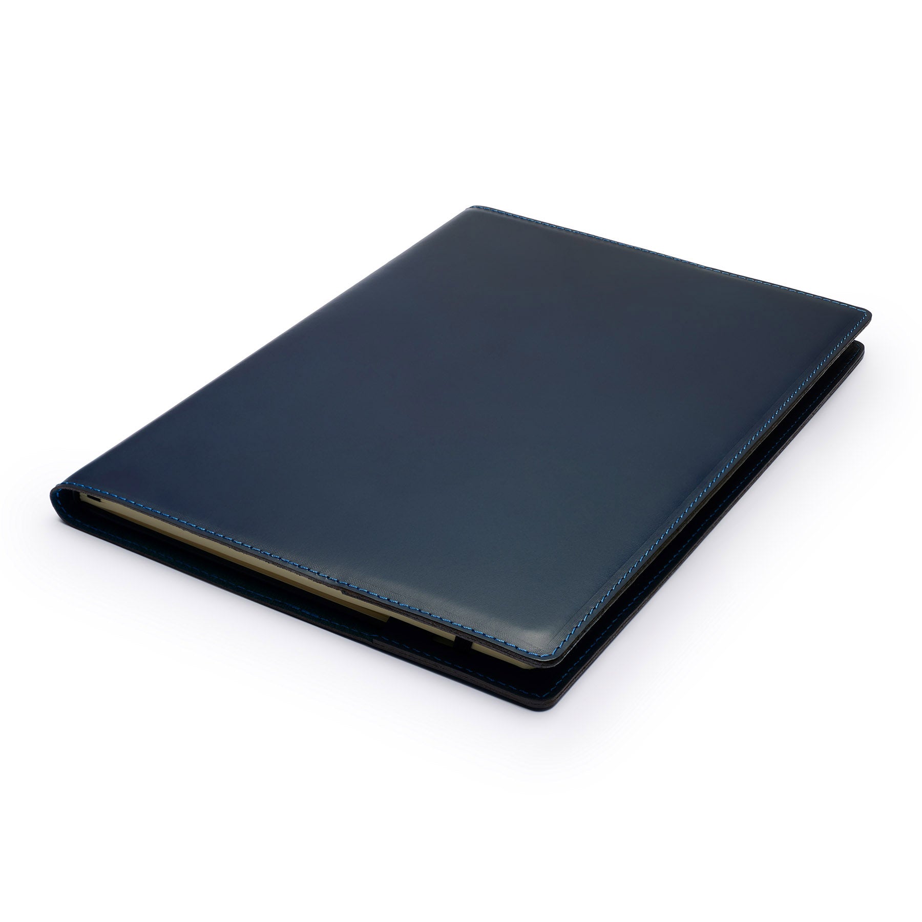Navy full-grain leather A4 notebook, flat lay, angled view — personalised — CarveOn, made in Ireland#Color_Navy