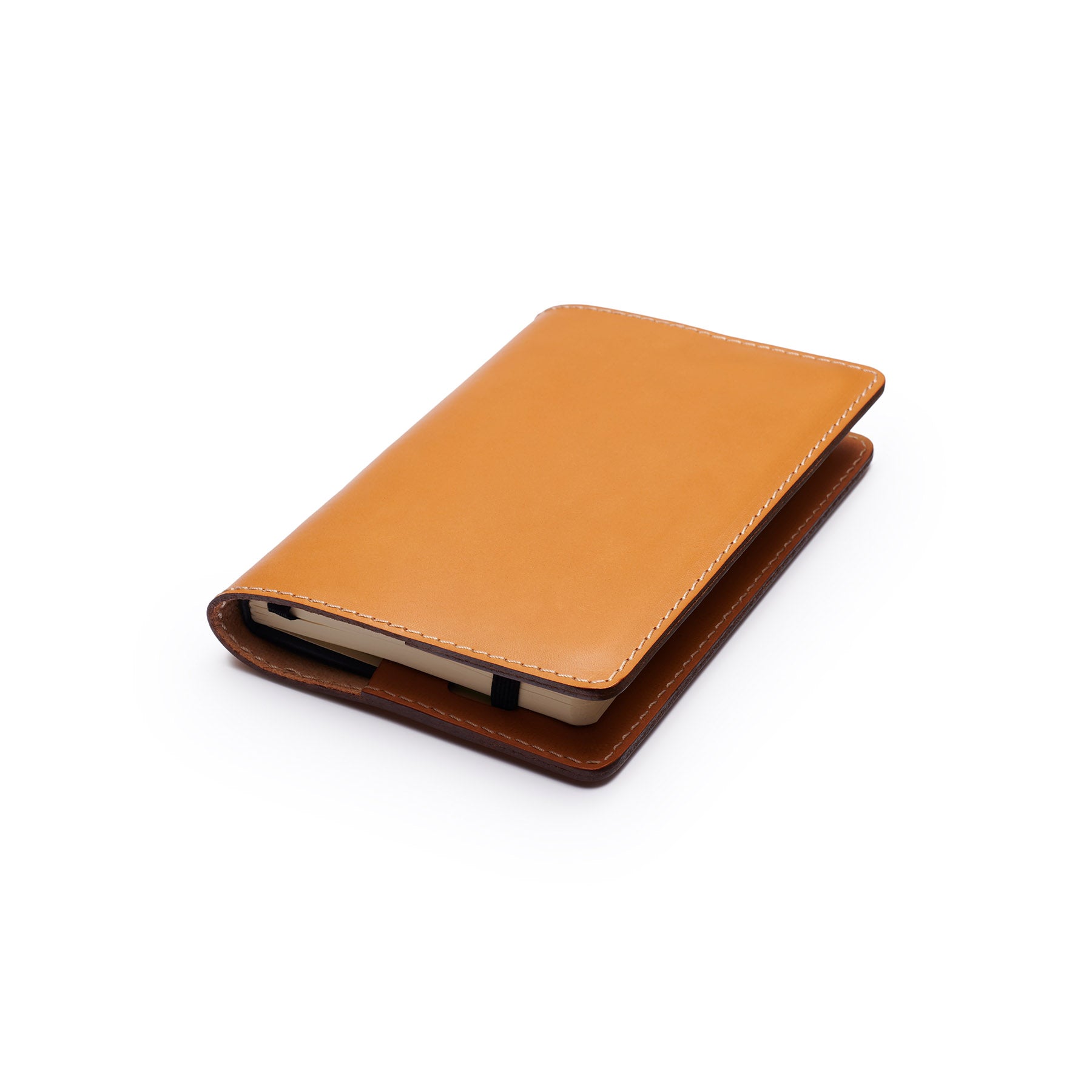 Tan full-grain leather A6 notebook, flat lay, angled view — personalised — CarveOn, made in Ireland#Color_Tan