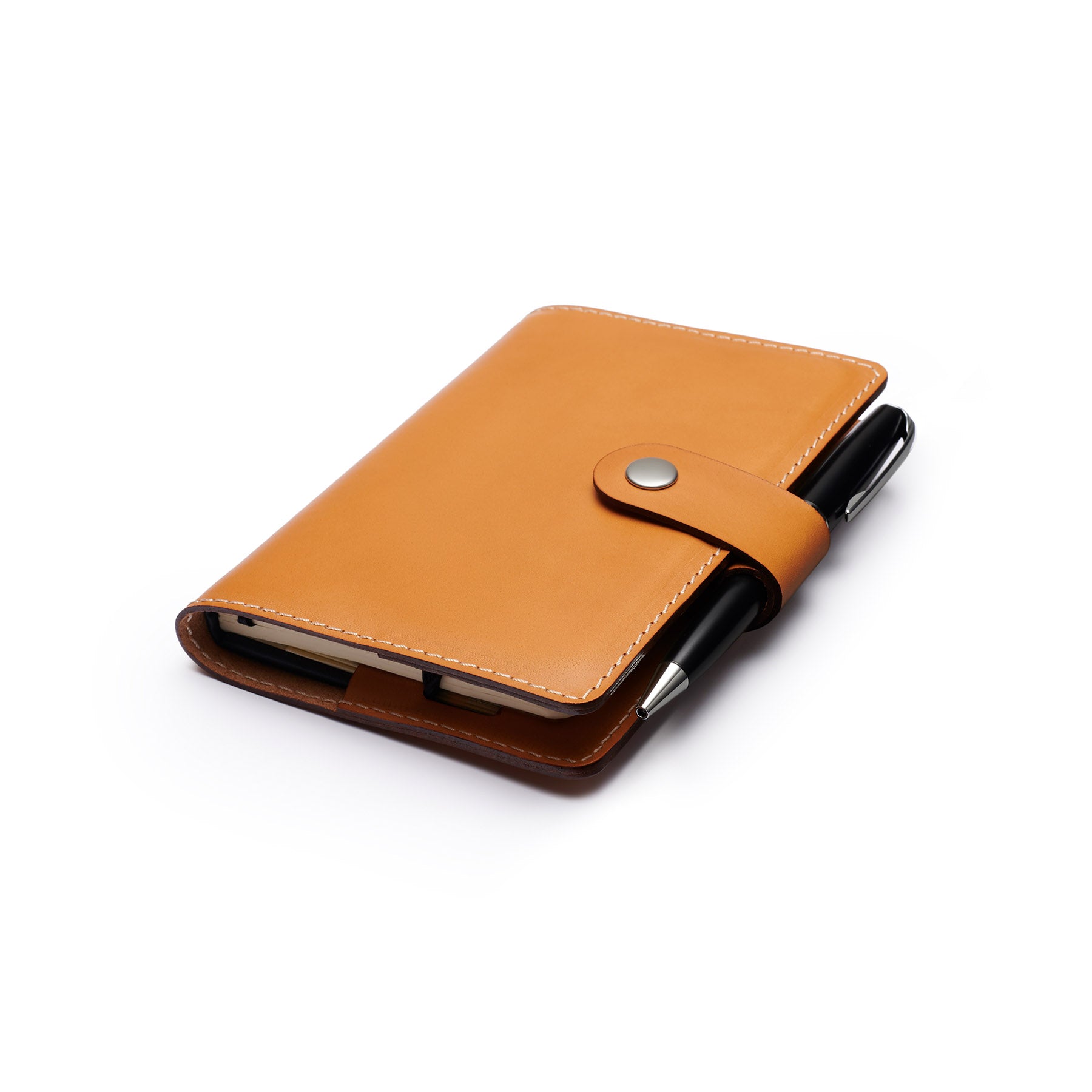 Tan full-grain leather A6 notebook and pen set, flat lay, angled view — personalised with debossed initials — CarveOn, mad...#Color_Tan