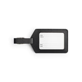 Black full-grain leather luggage tag, flat lay — personalised travel accessory — CarveOn, made in Ireland