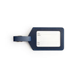 Navy full-grain leather luggage tag, flat lay — personalised travel accessory — CarveOn, made in Ireland