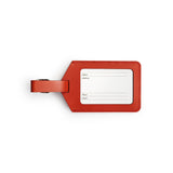 Red full-grain leather luggage tag, flat lay — personalised travel accessory — CarveOn, made in Ireland