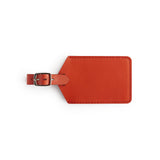 Red full-grain leather luggage tag, flat lay — personalised travel accessory — CarveOn, made in Ireland