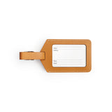 Tan full-grain leather luggage tag, flat lay — personalised travel accessory — CarveOn, made in Ireland