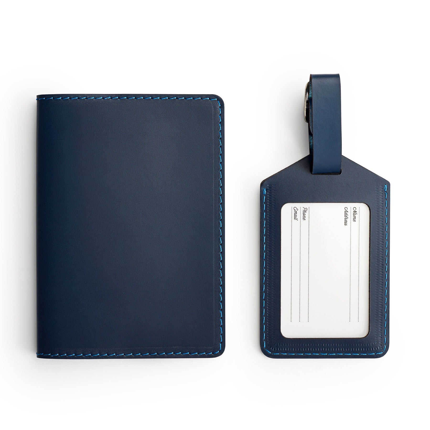 Navy leather travel gift set, flat lay — passport holder and luggage tag — CarveOn, made in Ireland#Color_Navy