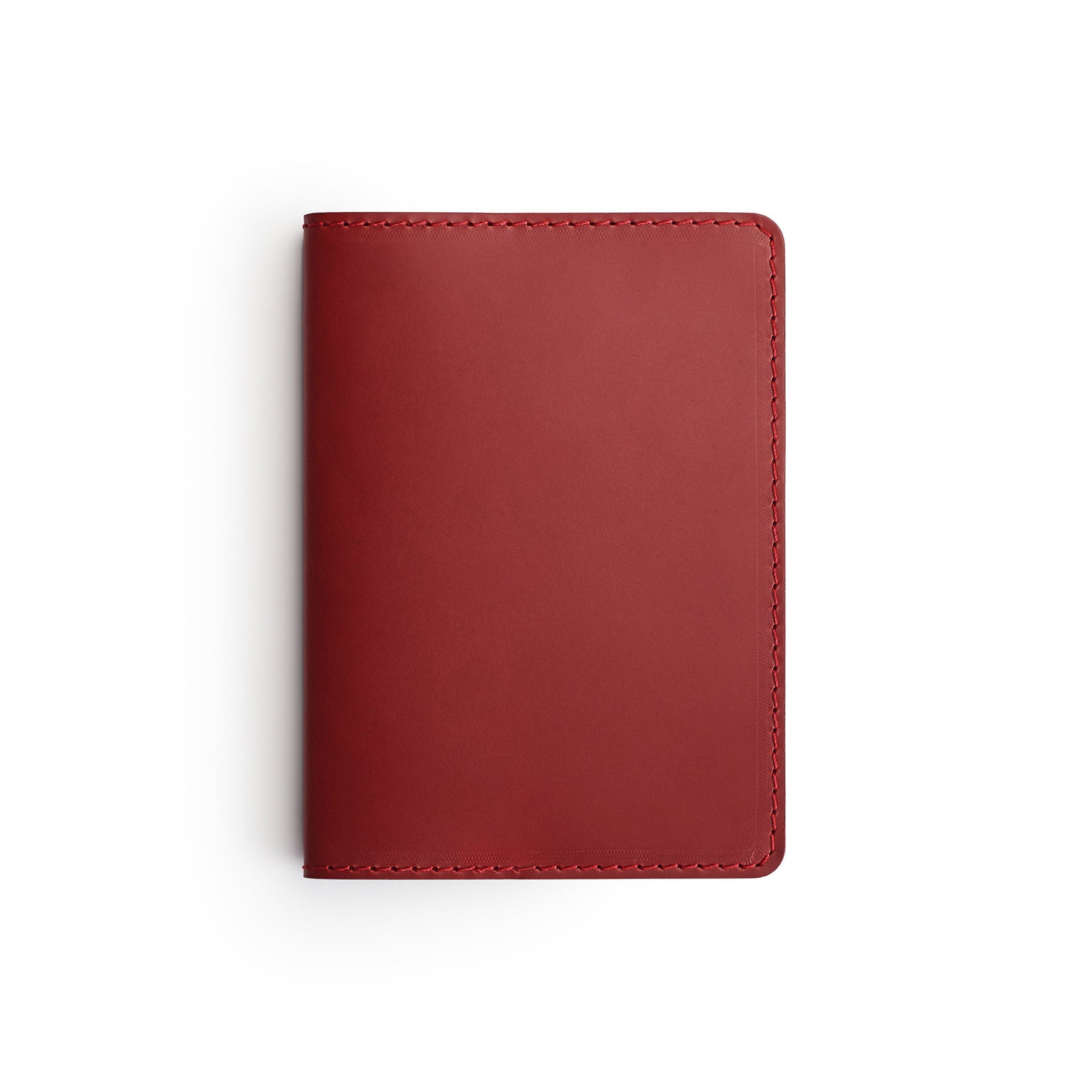 Burgundy full-grain leather passport holder, flat lay — personalised travel gift — CarveOn, made in Ireland#Color_Burgundy