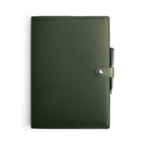 Green full-grain leather A4 notebook and pen set, flat lay — personalised with debossed initials — CarveOn, made in Ireland