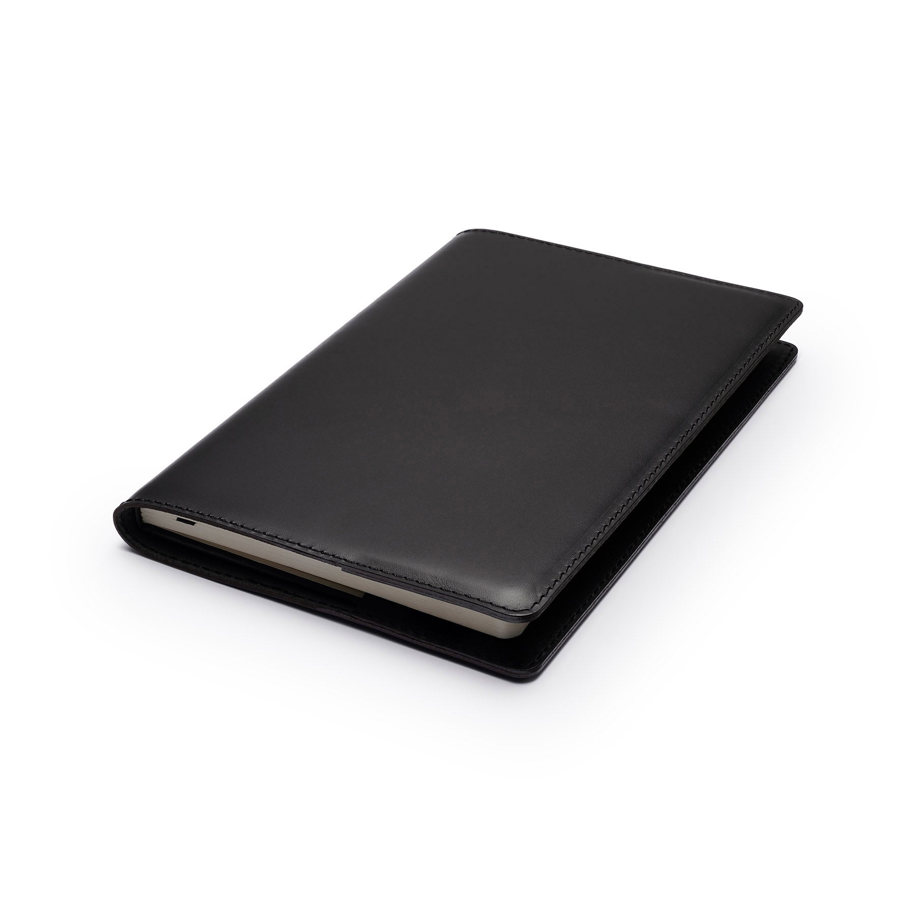 Black full-grain leather A5 notebook, flat lay, angled view — personalised — CarveOn, made in Ireland#Color_Black
