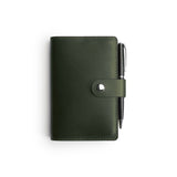 Green full-grain leather A6 notebook and pen set, flat lay — personalised with debossed initials — CarveOn, made in Ireland