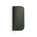 Green full-grain leather glasses case, flat lay — personalised — CarveOn, made in Ireland