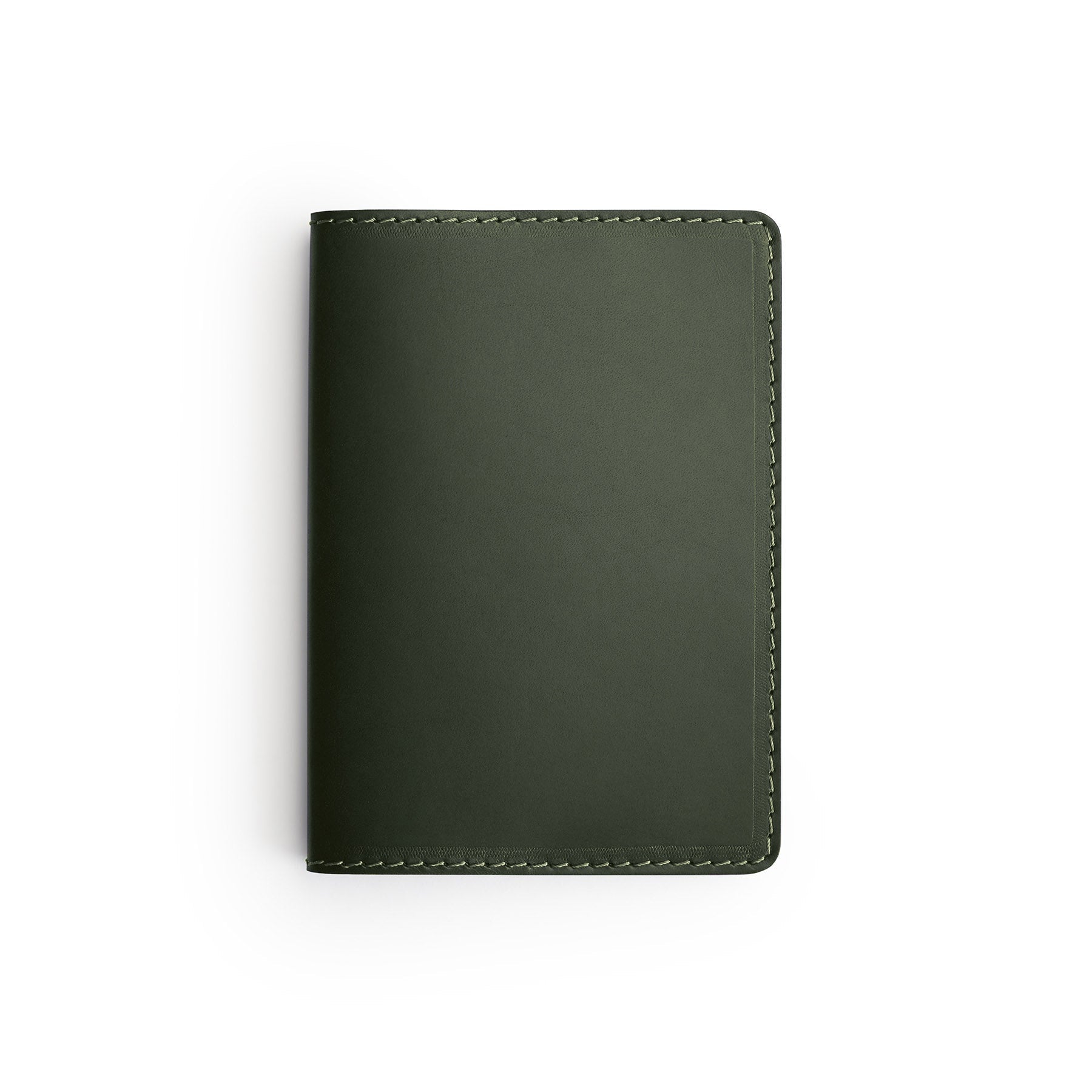 Green full-grain leather passport holder, flat lay — personalised travel gift — CarveOn, made in Ireland#Color_Green
