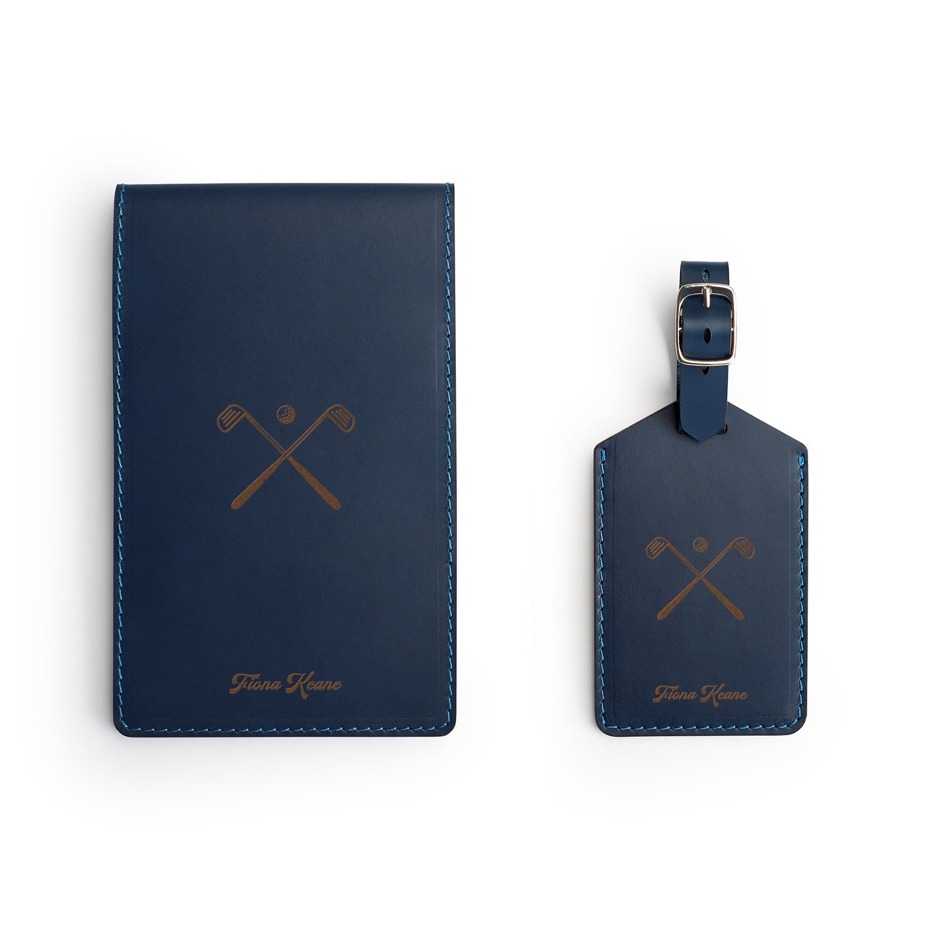 Navy leather golf gift set, flat lay, engraved with crossed golf clubs and a name — yardage book cover and bag tag — CarveOn, handmade in Ireland#Color_Hidden