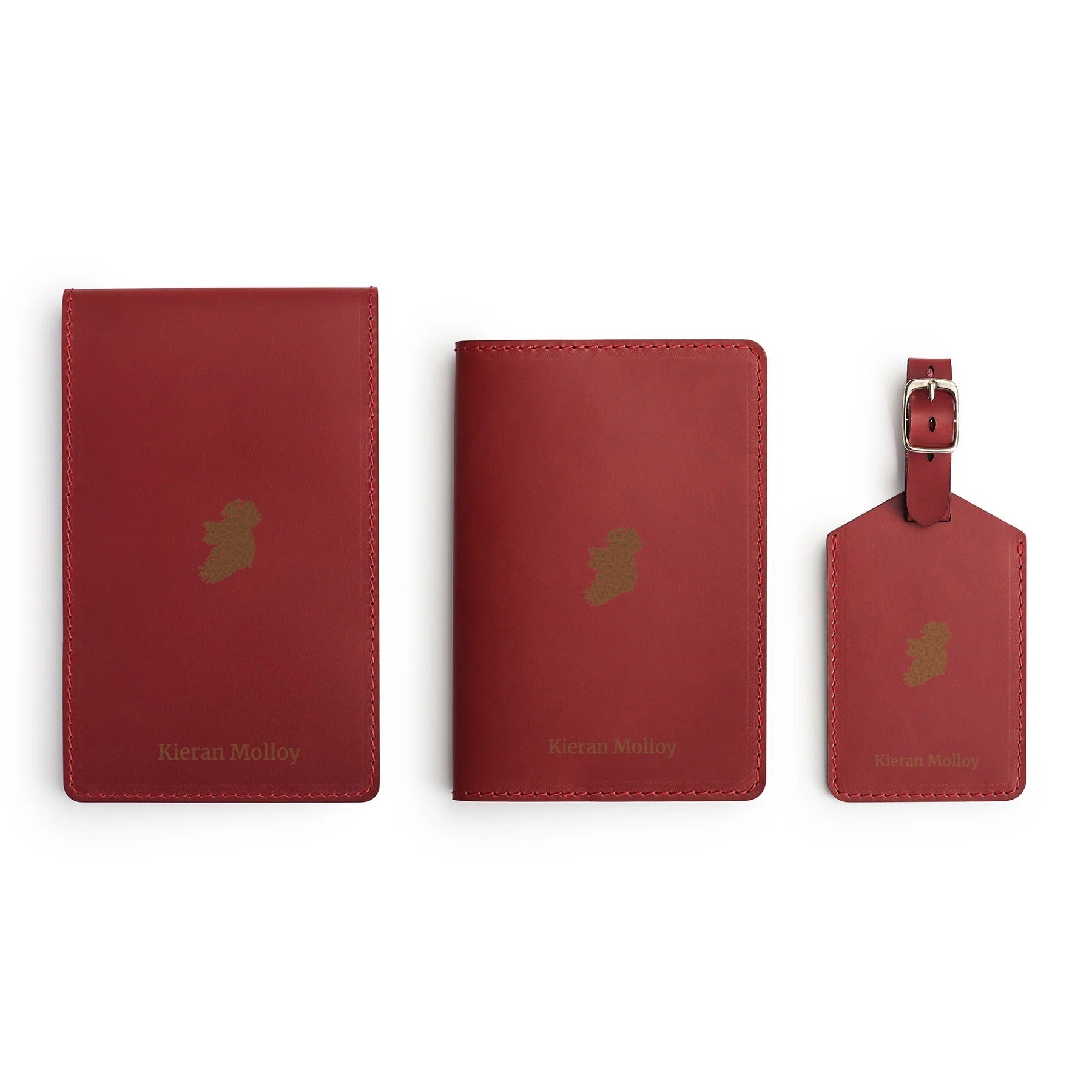 Burgundy leather golf gift set, flat lay, engraved with an Ireland graphic and a name — scorecard holder, yardage book cover and bag tag — CarveOn, handmade in Ireland#Color_Hidden