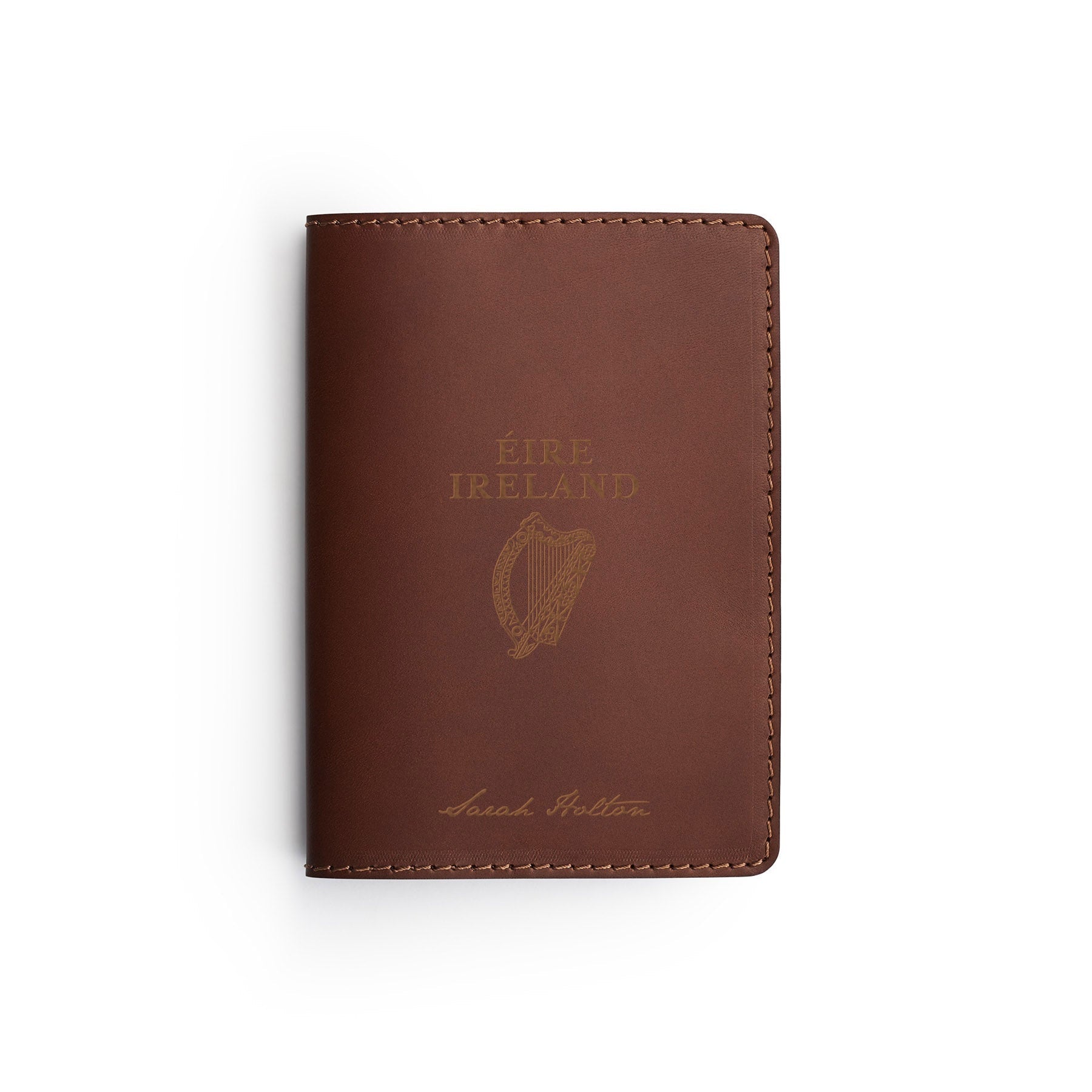 Dark Brown full-grain leather passport holder, flat lay, engraved with an Irish passport crest and a name — personalised travel gift — CarveOn, made in Ireland#Color_Dark Brown