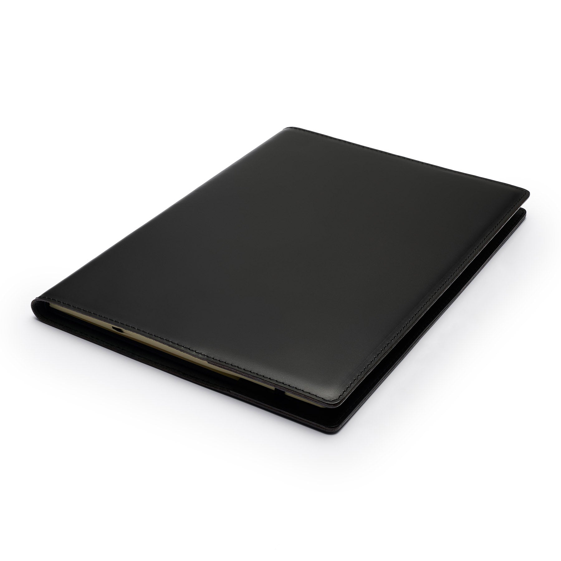Black full-grain leather A4 notebook, flat lay, angled view — personalised — CarveOn, made in Ireland#Color_Black