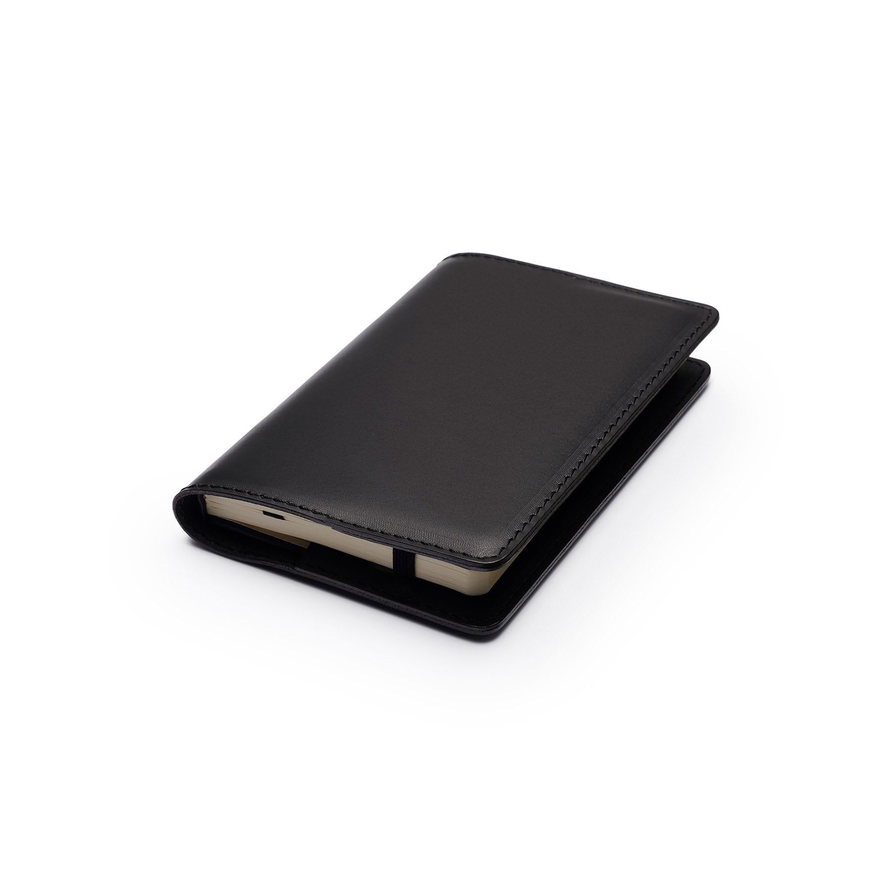 Black full-grain leather A6 notebook, flat lay, angled view — personalised — CarveOn, made in Ireland#Color_Black