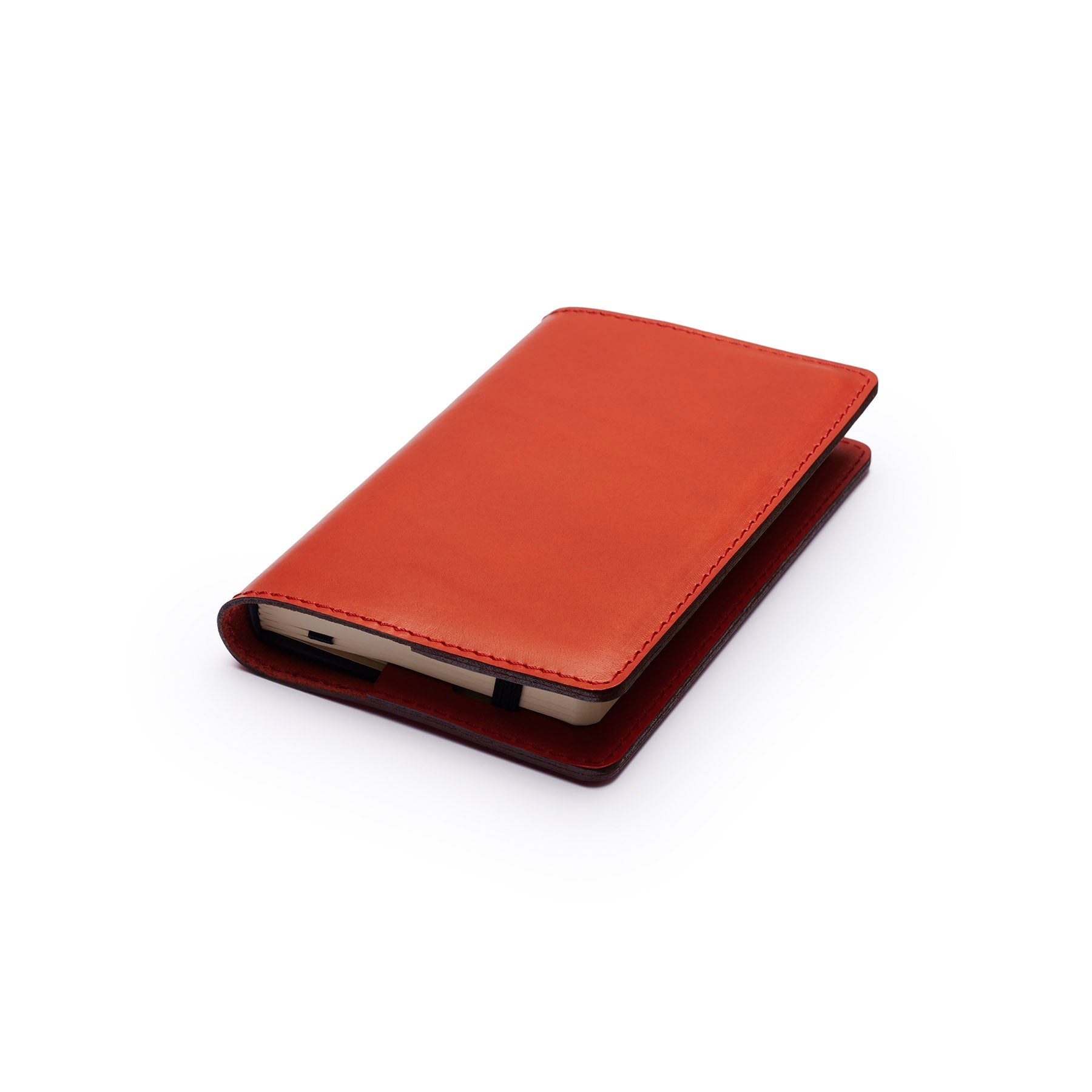 Red full-grain leather A6 notebook, flat lay, angled view — personalised — CarveOn, made in Ireland#Color_Red
