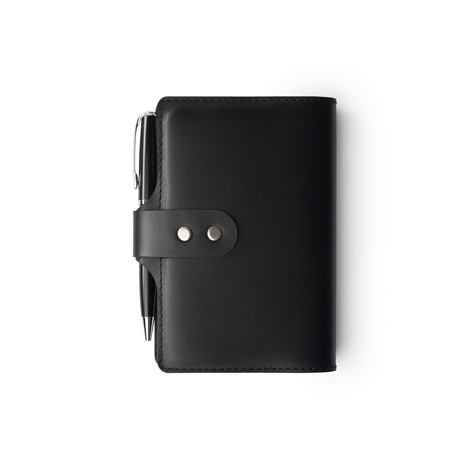 Black full-grain leather A6 notebook and pen set, flat lay — personalised with debossed initials — CarveOn, made in Ireland#Color_Black