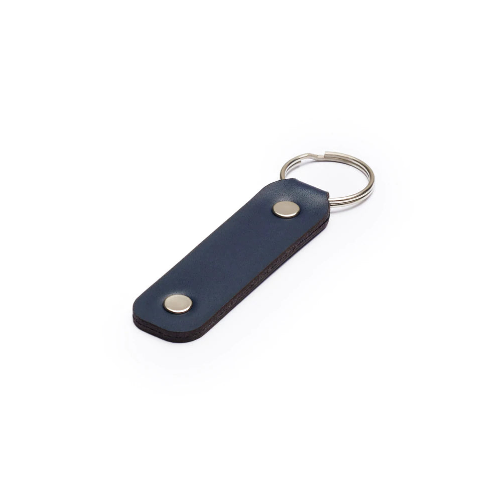 Navy full-grain leather keyring, flat lay, angled view — personalised gift — CarveOn, made in Ireland#Color_Navy