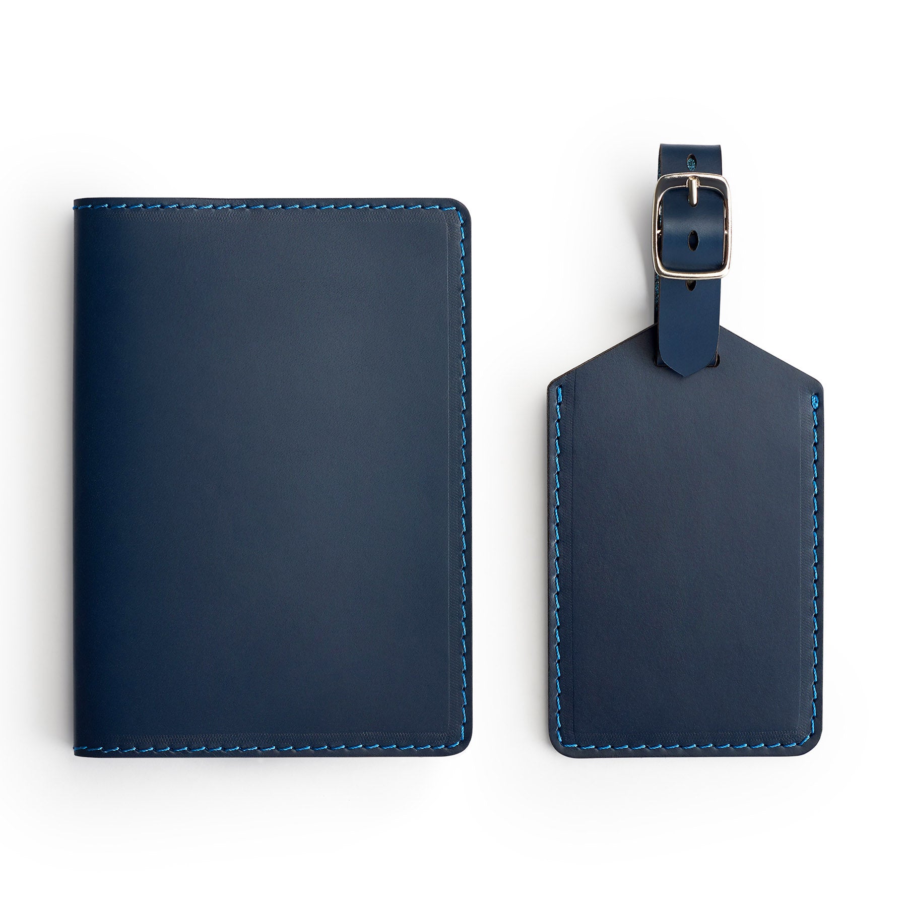 Navy leather travel gift set, flat lay — passport holder and luggage tag — CarveOn, made in Ireland#Color_Navy
