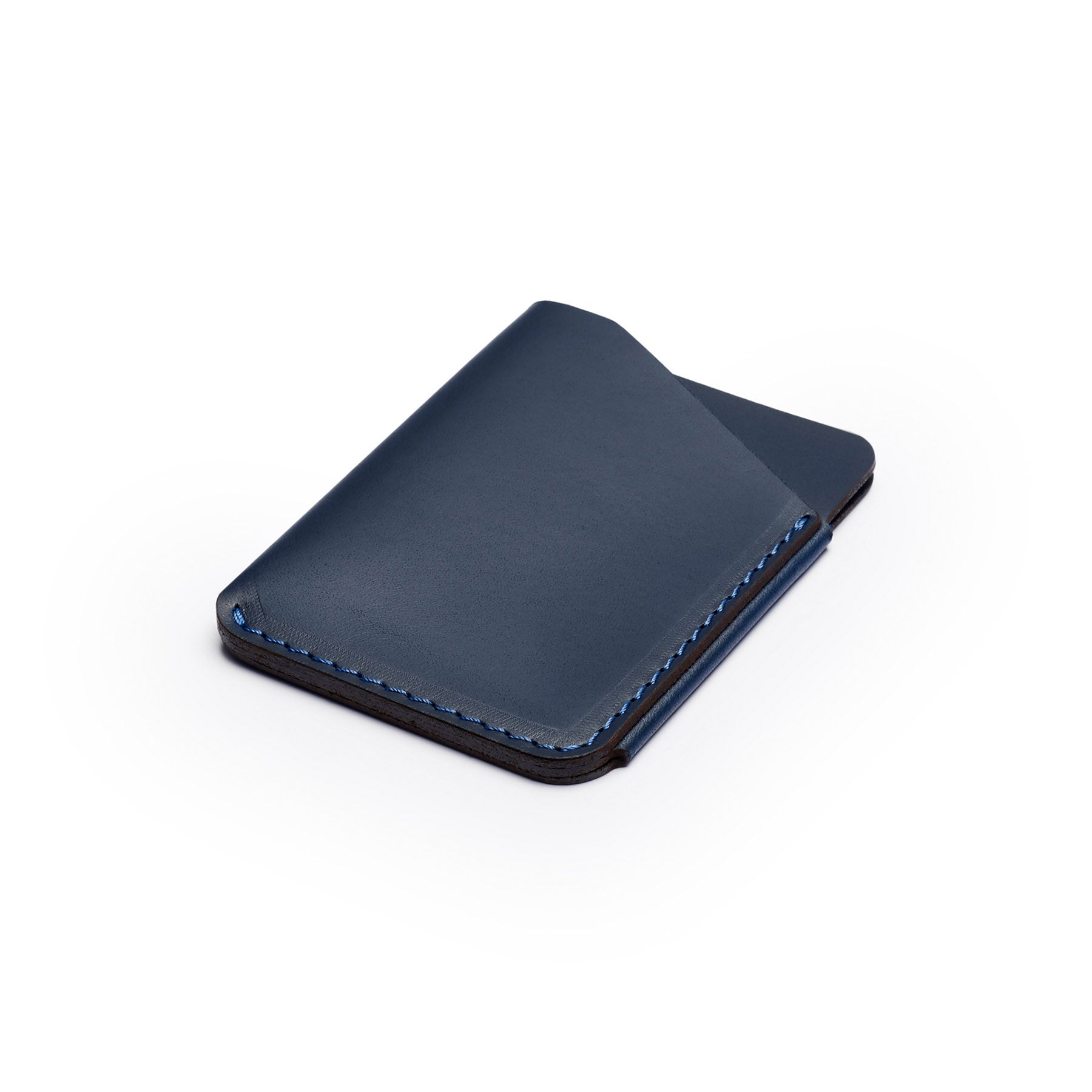 Navy full-grain leather quick-draw wallet, flat lay, angled view — personalised — CarveOn, made in Ireland#Color_Navy