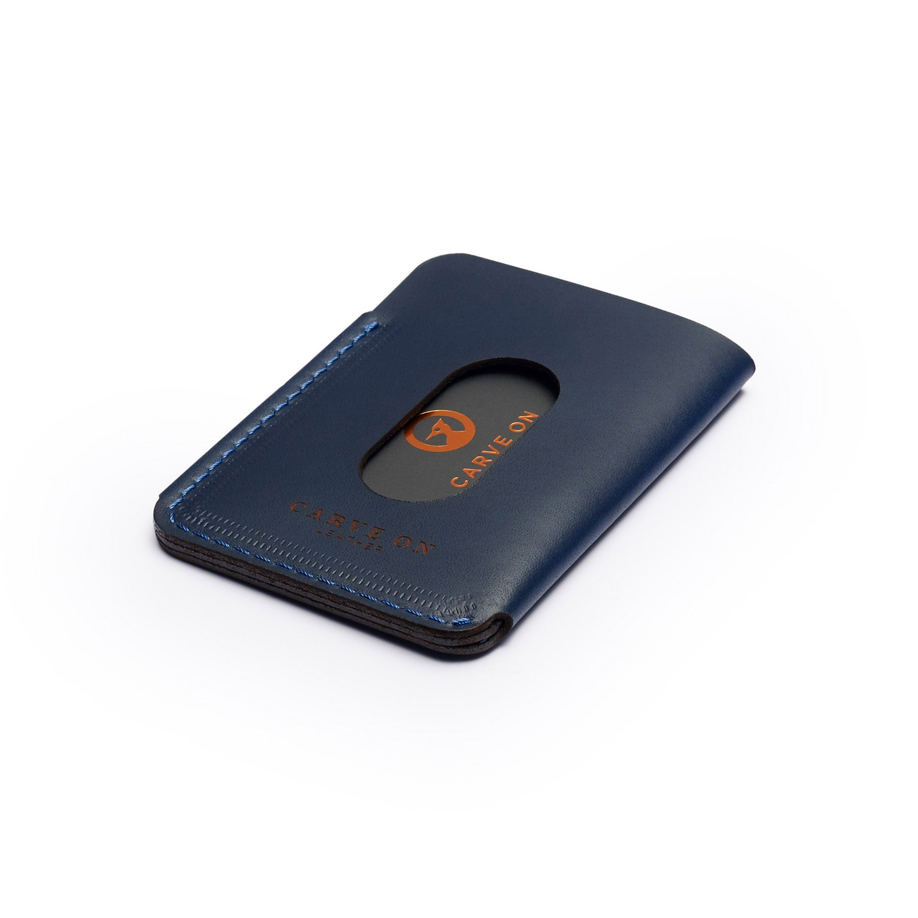 Navy full-grain leather quick-draw wallet, flat lay, angled view — personalised — CarveOn, made in Ireland#Color_Navy