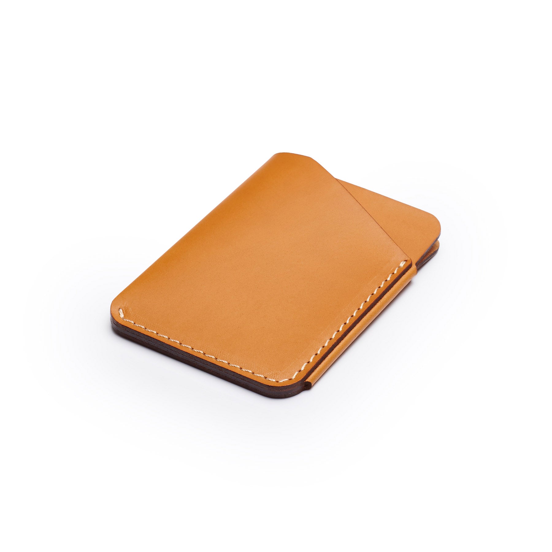 Tan full-grain leather quick-draw wallet, flat lay, angled view — personalised — CarveOn, made in Ireland#Color_Tan