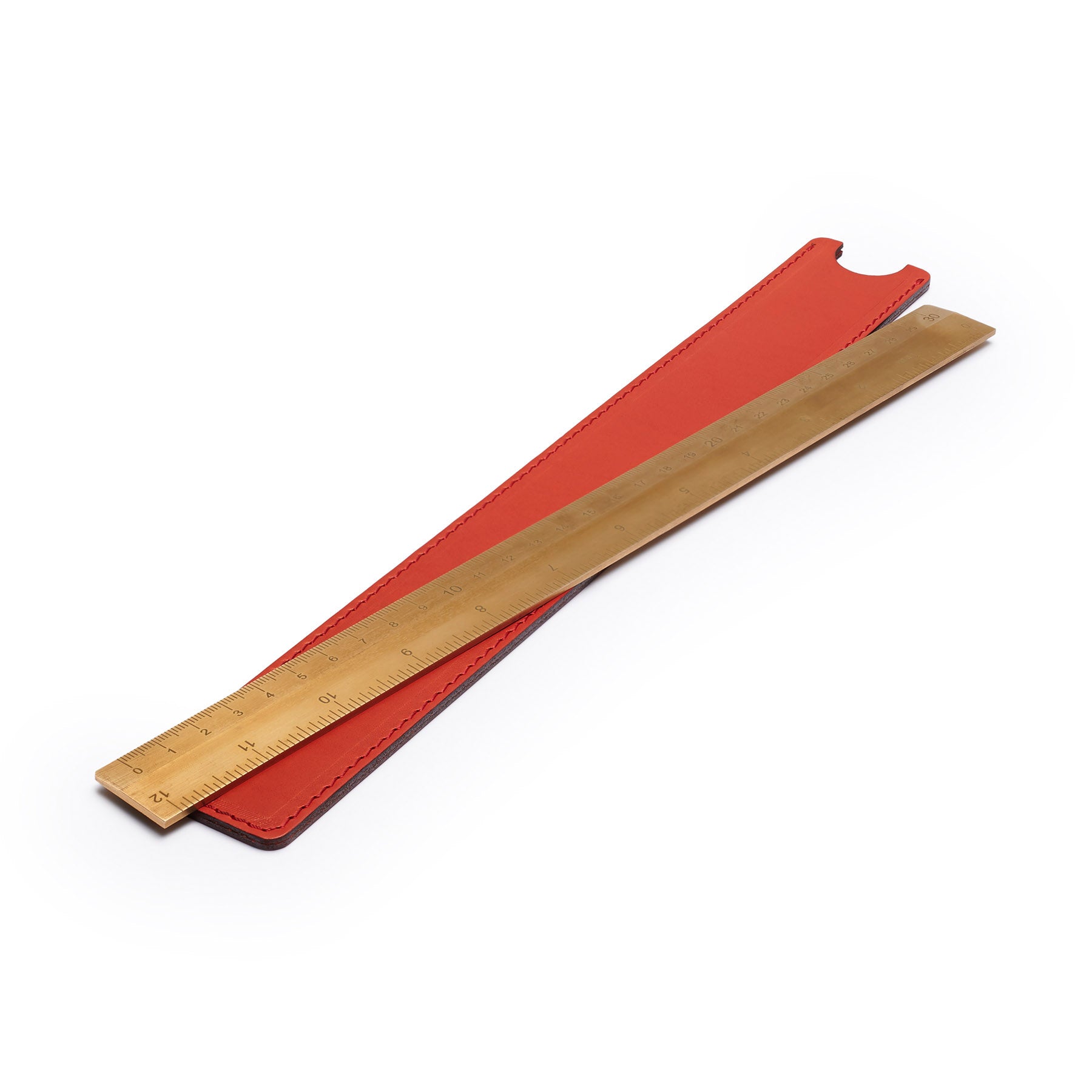 Red solid brass ruler with leather sheath, flat lay, angled view — desk gift — CarveOn, made in Ireland#Color_Red