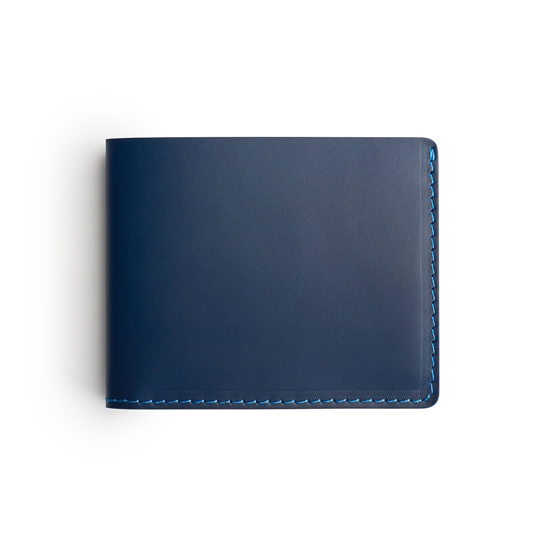 Navy full-grain leather traditional wallet, flat lay, angled view — personalised — CarveOn, made in Ireland#Color_Navy