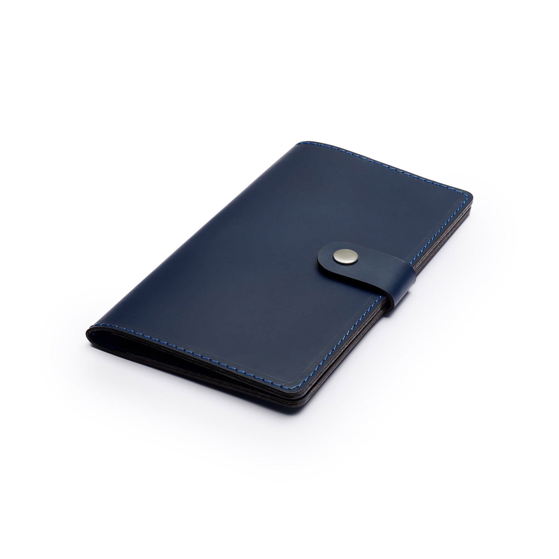 Navy full-grain leather travel wallet, flat lay, angled view — personalised — CarveOn, made in Ireland#Color_Navy